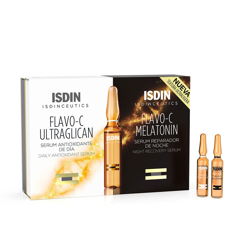 Two glass ampoules in white, black and gold with boxed packaging and gold-sparkle detail, Isdin