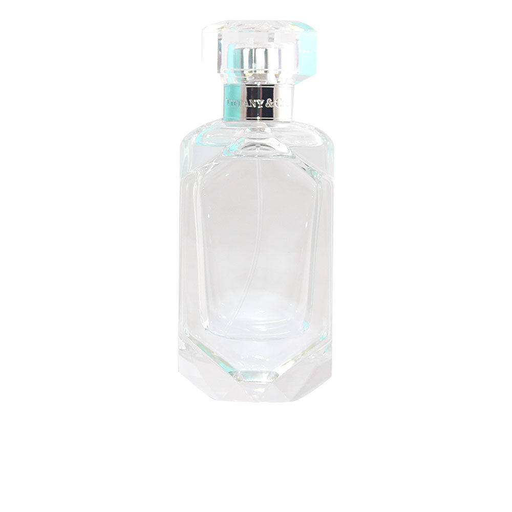 50 ml clear glass perfume bottle with pale floral eau, minimalist cap