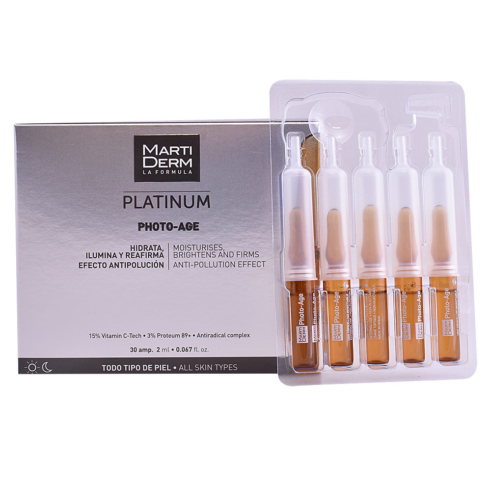 Small glass anti‑age ampoule with clear fluid, vitamin C and hyaluronic formula