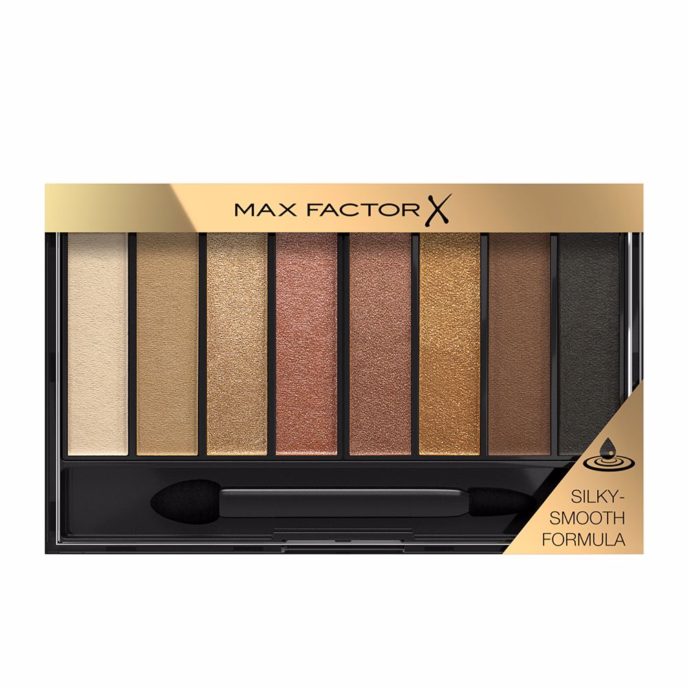 Compact eyeshadow palette with eight golden nude shades and dual‑ended applicator
