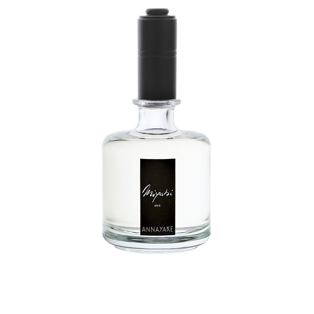 100 ml bottle of sandalwood-spiced Eau de Parfum for Man, amber liquid