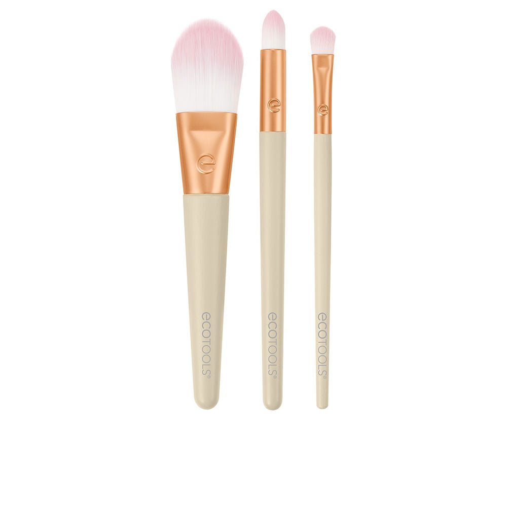 Five-piece makeup brush set with beige handles, rose-gold ferrules, soft pink-tipped synthetic bristles — Ecotools.