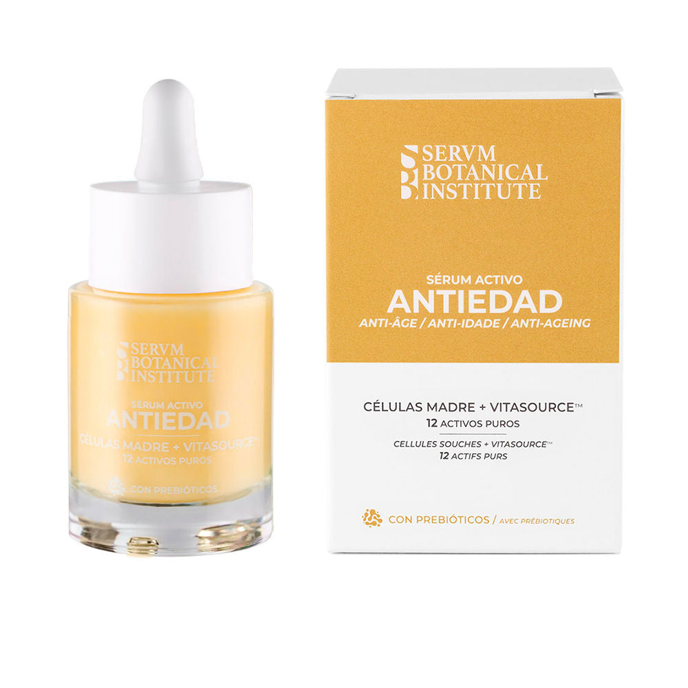 Servm Botanical Institute Minimalist glass serum bottle with white dropper cap and yellow label beside cardboard box