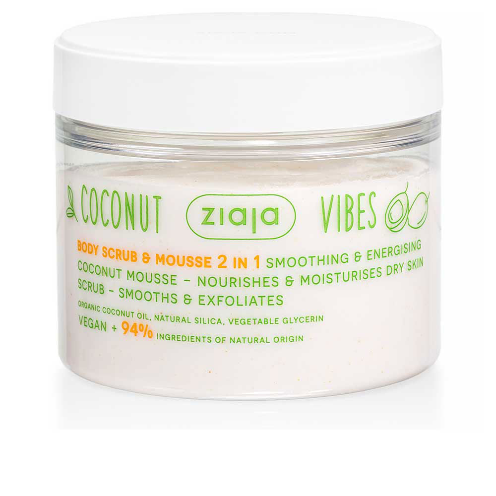 Ziaja Transparent plastic jar with white screw lid, coconut illustrations, green and orange text, creamy white scrub
