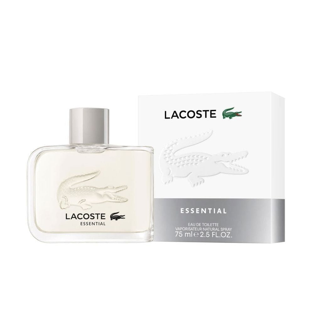 Bottle of Lacoste Essential Eau de Toilette for men beside green leaves