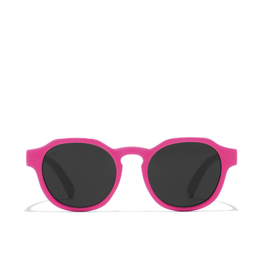 Hawkers Pink round sunglasses for kids with dark tinted lenses and slim temple arms