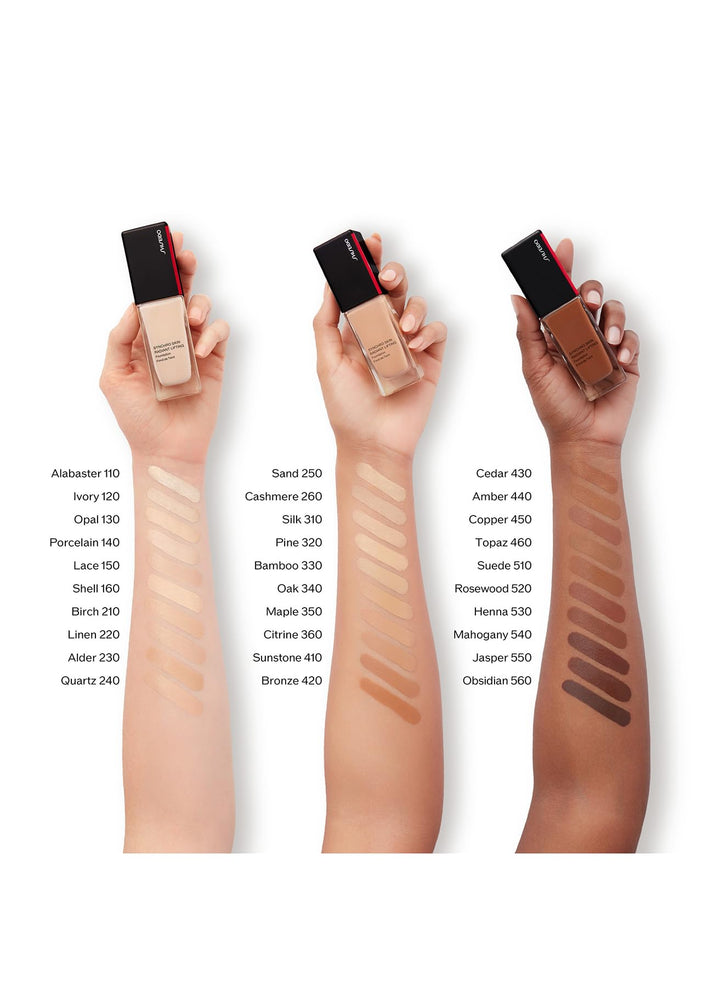 Shiseido Glass rectangular foundation bottle showing beige liquid, black cap with red stripe and printed text