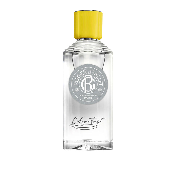 Roger &amp; Gallet Transparent glass cologne bottle with clear yellow liquid, ribbed yellow cap, round gray label, black cursive text, presented .