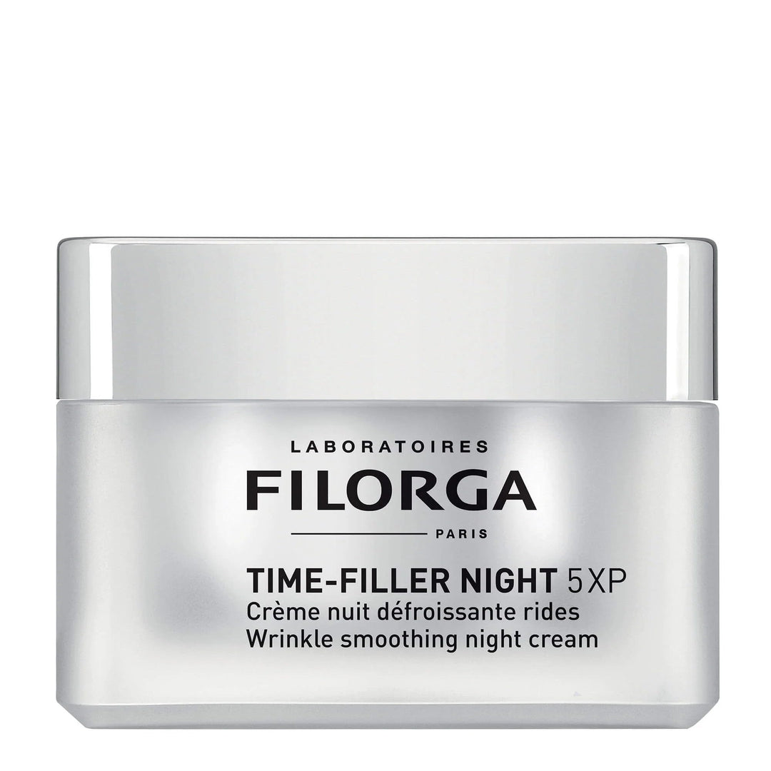 Laboratoires Filorga Glass jar of night cream with silver lid, minimalist label visible — celebrates refined skincare.