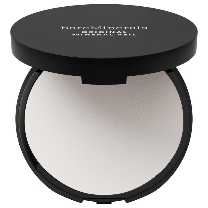 Compact translucent pressed powder, 9 g, includes sponge, semimate finish