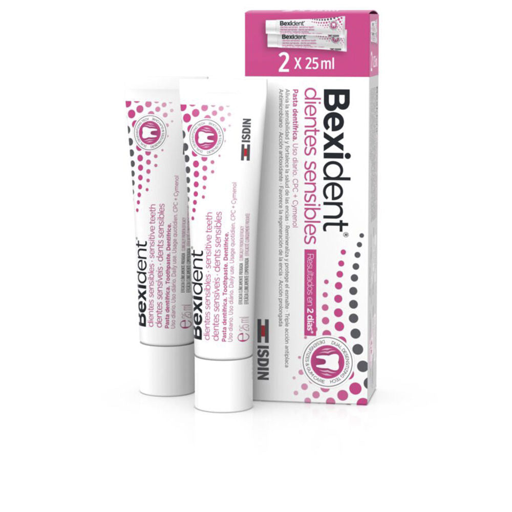 Isdin Two white and pink plastic toothpaste tubes and black-accented box with dots pattern, photographed simply