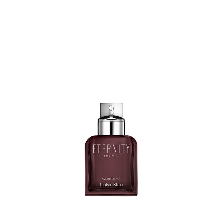 Calvin Klein Deep burgundy glass perfume bottle with metallic silver cap and minimalist labeling, modern silhouette.