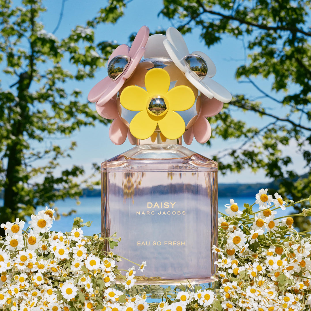 Marc Jacobs Pink glass Eau de Toilette spray with flower-shaped cap, gold accents, printed text, floral box