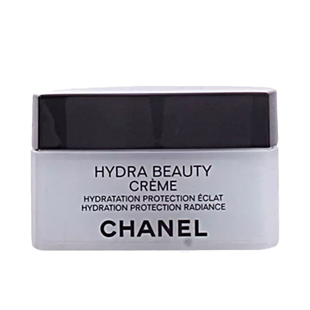 Chanel Minimalist rectangular plastic face cream container with black lid, printed front text, white and black compact design