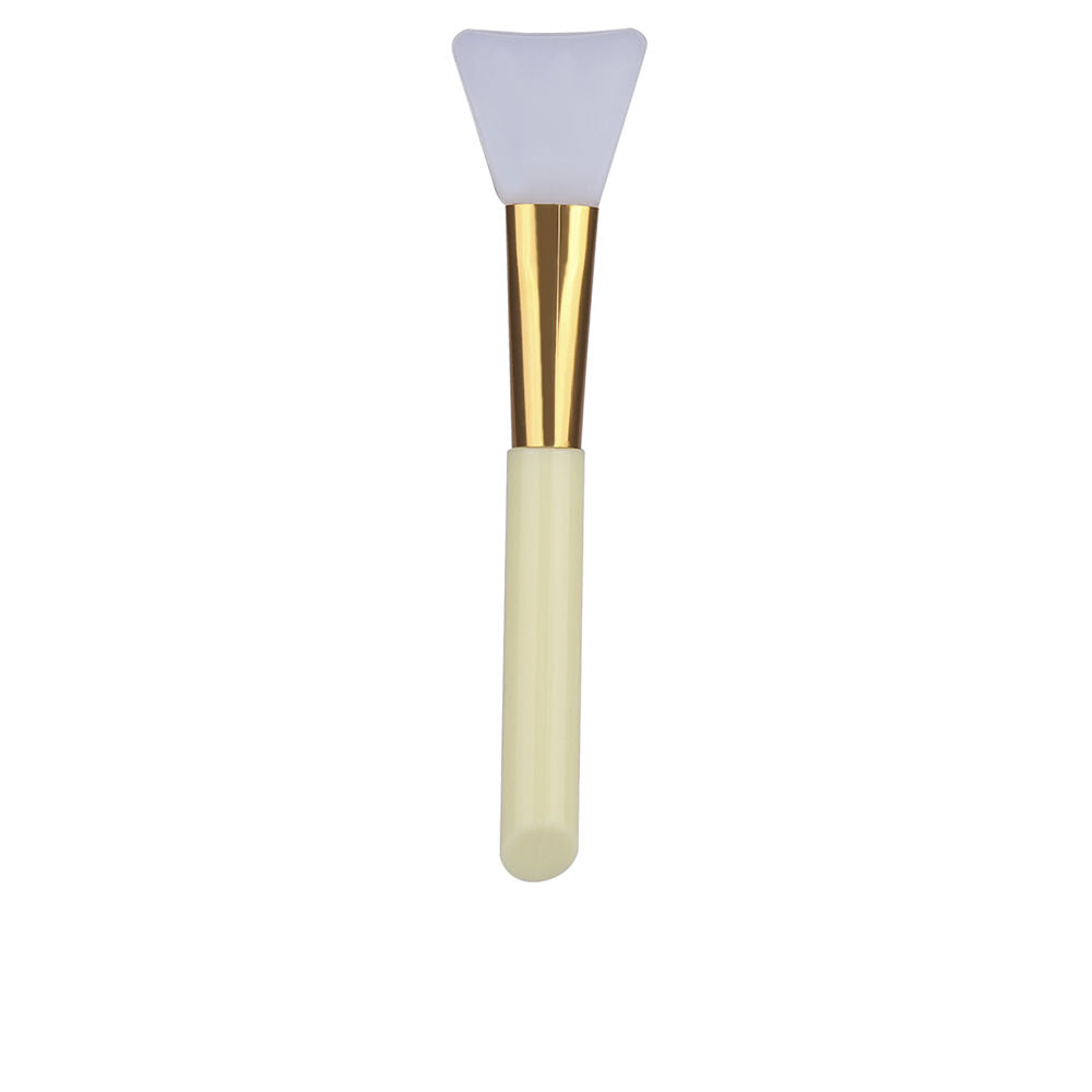 Paloma Beauties White and cream silicone facial mask applicator with triangular silicone tip and gold ferrule