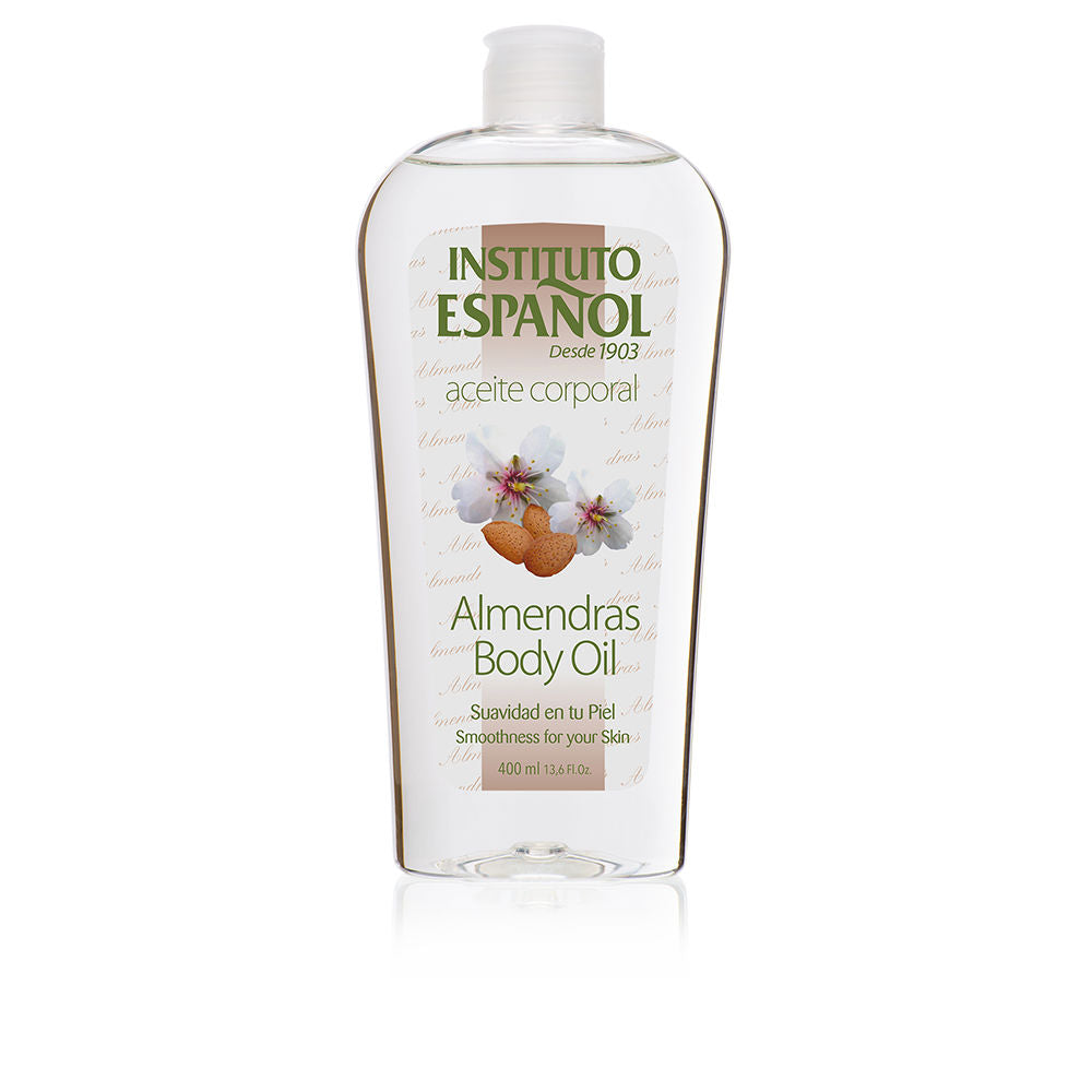 Instituto Español Clear plastic body oil bottle with flip-top cap, label showing almonds and flowers, readable text