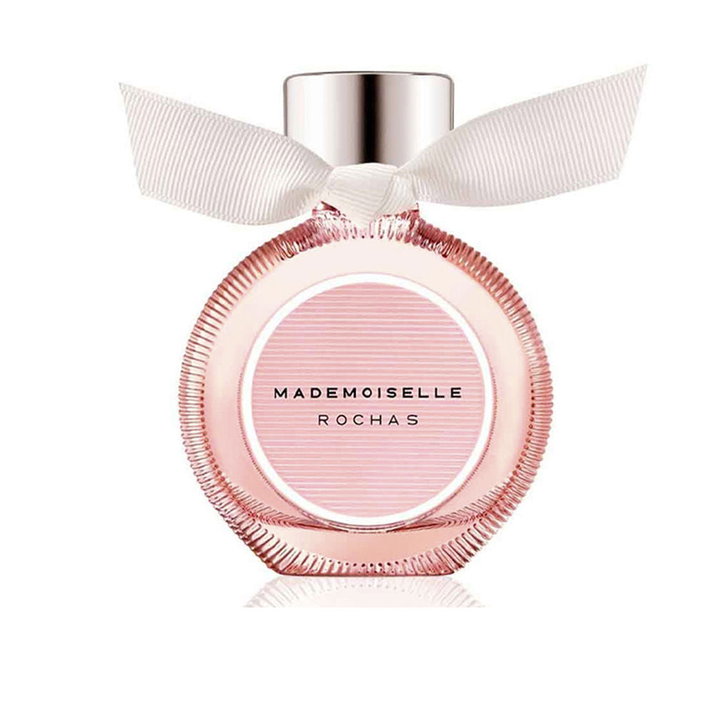Rochas Glass round pink perfume bottle with metallic cap and white ribbon bow, elegant modern design