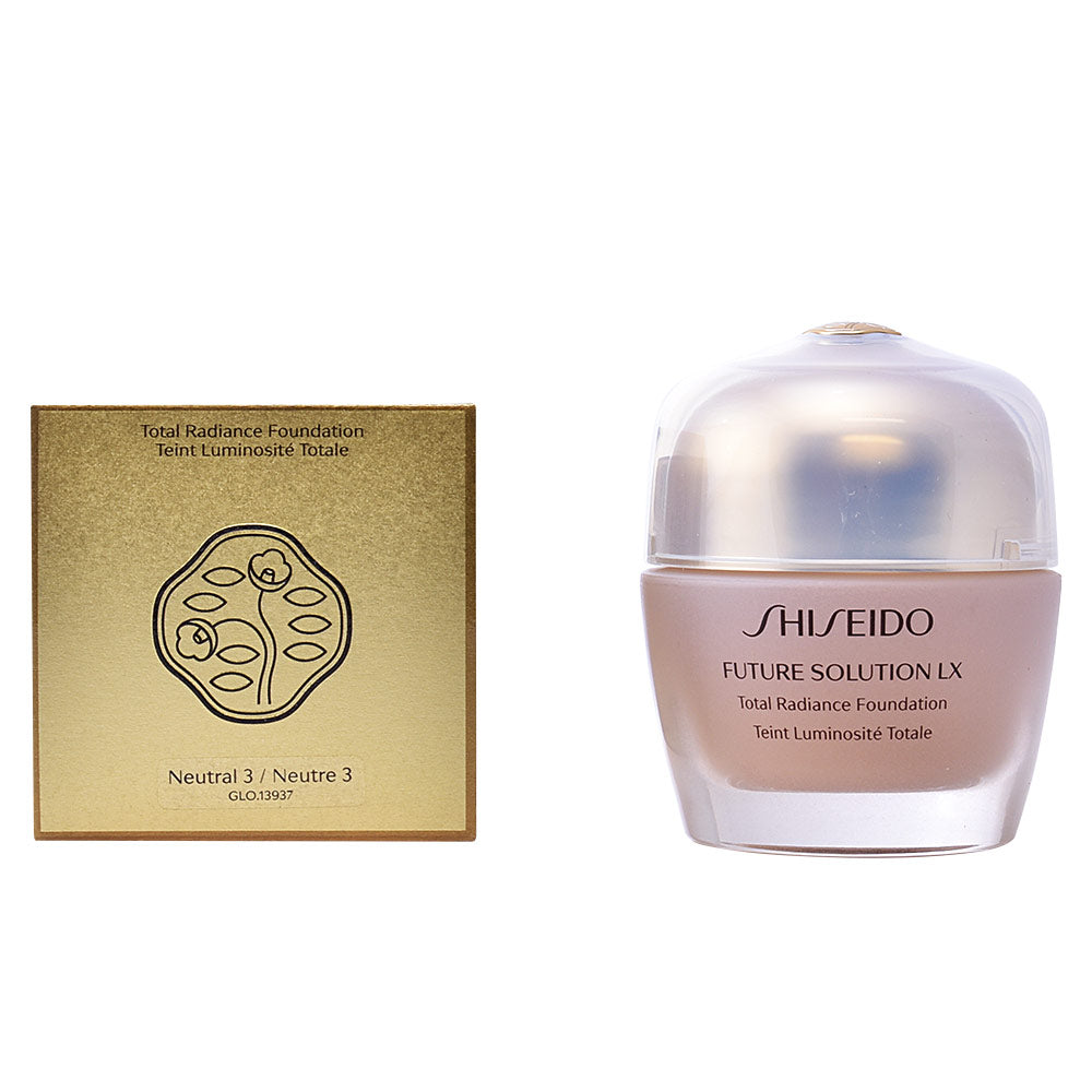 Shiseido Gold and beige foundation jar with lid beside matching box, plastic jar and cardboard box visible
