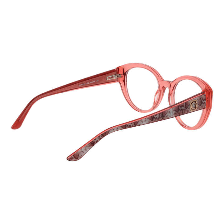 Transparent pink cat-eye eyeglasses with snake-skin patterned temples and small gold emblem