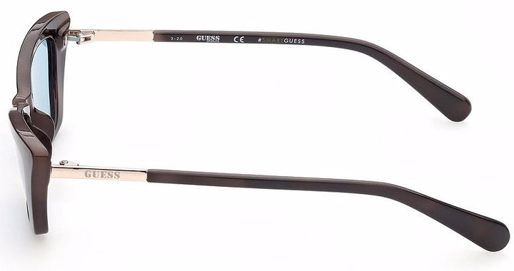 Black cat-eye sunglasses with light-blue lenses and gold accents, logo on lens and temples