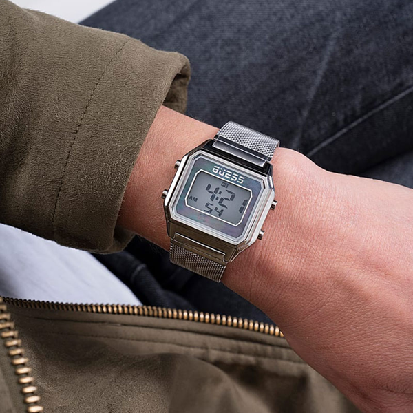 Silver stainless steel digital watch with mesh bracelet and clear day-date display, modern Unisex design