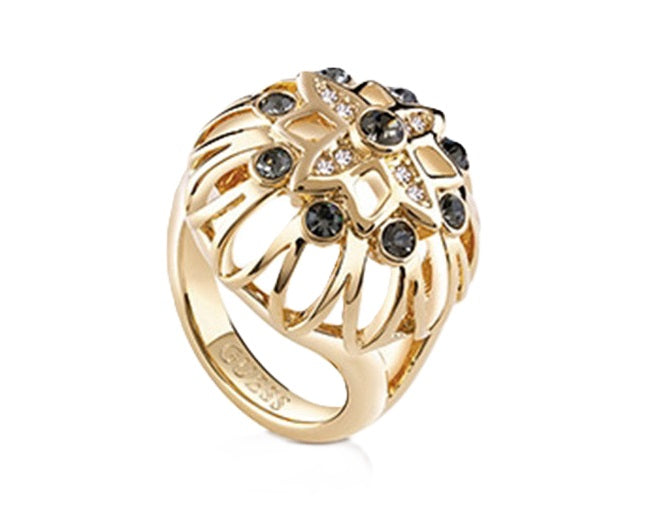 Gold-tone openwork ring set with black and clear stones, ornate decorative design on neutral background