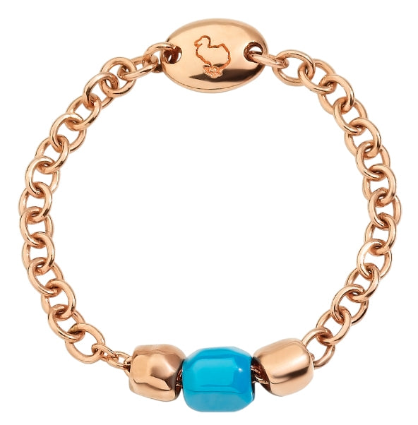Rose gold chain bracelet with turquoise enamel bead and engraved charm on neutral background