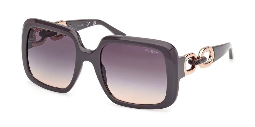 Dark purple oversized square sunglasses with gradient lenses and gold chain-link detail on temples
